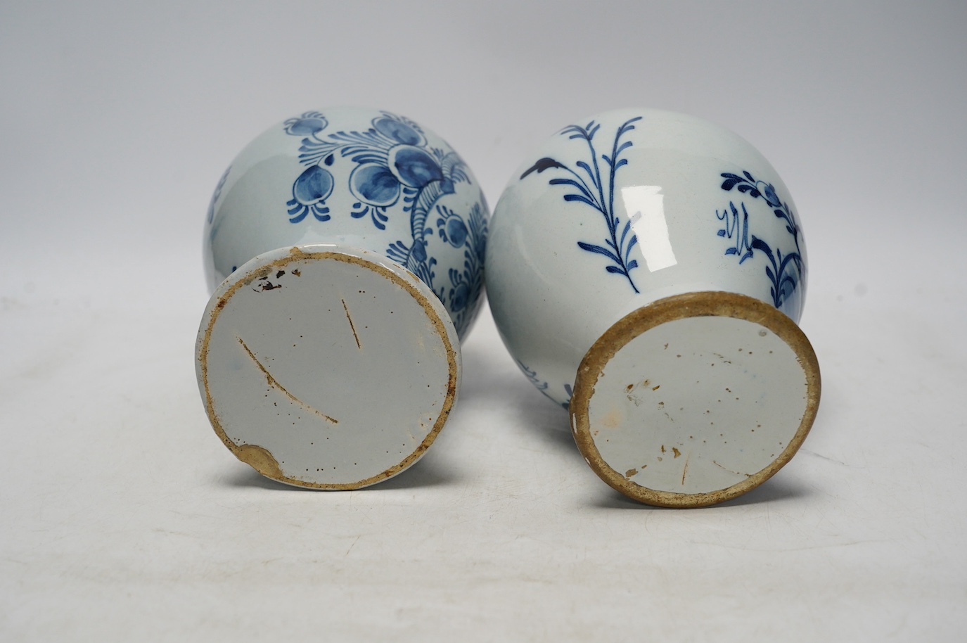 Two 18th century delft blue and white baluster vases, 18.5cm